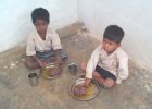 two boys eating lunch